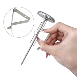 A stainless steel instant read dial thermometer being held, featuring a circular dial and a triangular probe.