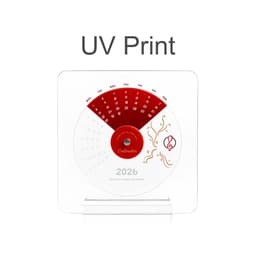 Acrylic desk calendar with a red and white design, featuring dates and decorative elements for the year 2026.