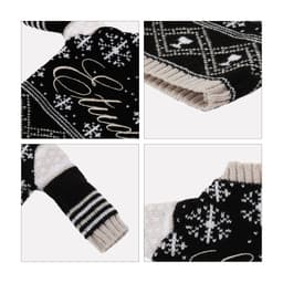 A drink bottle sleeve featuring a black and cream knitted design with intricate patterns and a snug fit.