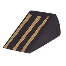 A wedge-shaped black stress reliever with three gold stripes running along the top.