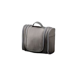 A grey storage bag with zippers and a handle, featuring multiple compartments and a sleek design.