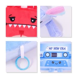 A red and blue plush toy with a cartoon face, featuring an O ring attachment. Includes a logo or branding element.