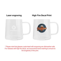 A glass mug with a clear design, featuring a logo and a colourful decal on one side.