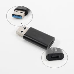A USB data blocker in black with a USB-A connector on one end and a USB-C port on the other. Features a logo.