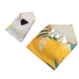 Two vibrant self-adhesive cloth pouches in floral and tropical leaf designs, one with a phone and the other with cosmetics.