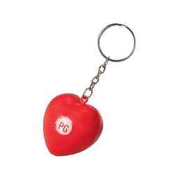 A red heart-shaped stress reliever attached to a silver keyring, featuring a small logo.