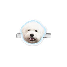A custom shape acrylic hair clip featuring a smiling white dog face with a light blue border.