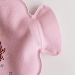 A pink hot water bottle with a plush cover featuring a soft texture and cartoon design.