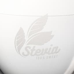 A white container with a textured leaf design and the word "Stevia" embossed on it.