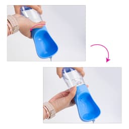 A drink bottle with a blue basin and clear body, featuring a logo, designed for pets with a food container.