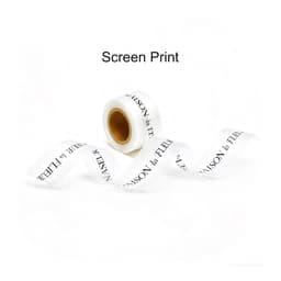 A roll of white soft ribbon with black screen-printed text, featuring a logo at one end.