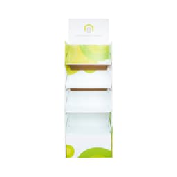 A white cardboard floor display with green circular designs and multiple shelves for product placement.