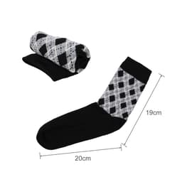 A pair of black and grey patterned socks, one rolled up, showcasing a woven design with a towel bottom.