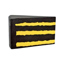 A chocolate cake-shaped stress reliever in black with yellow stripes, featuring a textured surface and a branding logo.