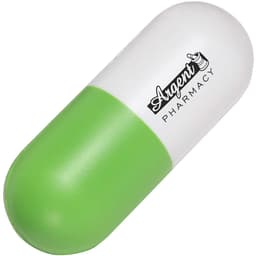 A capsule-shaped stress reliever in green and white, featuring a logo.