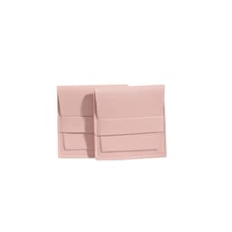 A set of two pink PU leather flip jewelry pouches with a secure closure and neat stitching.