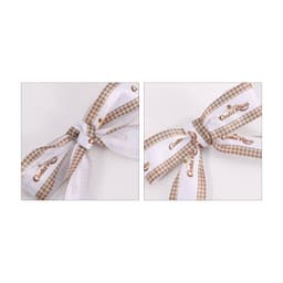 A set of two twist tie bows featuring a white and brown checkered design with branding.