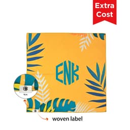 A vibrant yellow self-adhesive cloth with tropical leaf designs and a woven label in the corner.