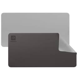 A PU leather desk mat featuring grey and black colours, with a logo in the corner and a smooth finish.