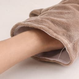 A crocodile hand puppet in a light brown plush material, featuring a hand reaching inside for control.