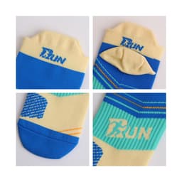 A pair of No Show Running Socks in blue and cream, featuring a logo and vibrant patterns.