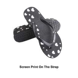 Classic black thongs featuring a heart print on the strap and a textured sole. Includes a logo on the side.