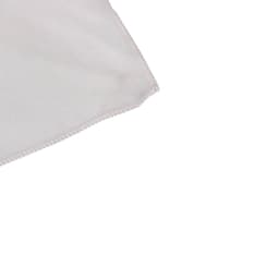 A light grey quick dry towel with stitched edges, featuring a logo. Ideal for gym and outdoor activities.