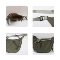 An olive green Dumpling Crossbody Bag with adjustable straps and zippered compartments, featuring a neutral interior.