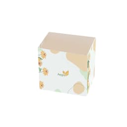 A custom packaging sleeve in pastel colours with floral designs and a logo on the side.