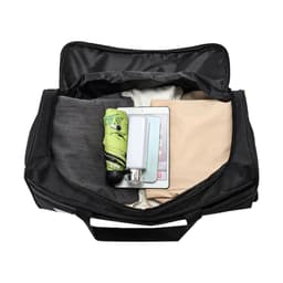 A wheeled duffel bag in black, filled with clothing, an umbrella, and a drink bottle, features a logo on the exterior.