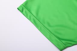 A bright green fabric section of a unisex long-sleeve V-neck shirt with a smooth finish and a branded logo.