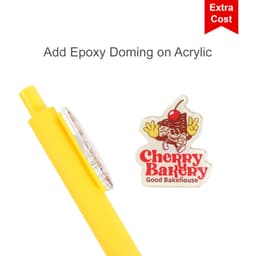 A yellow acrylic pen with a round top and a logo featuring a cherry on a bakery theme.