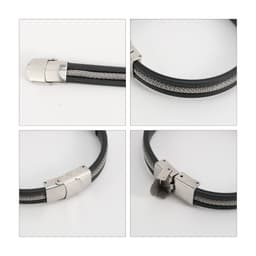 A sleek black bracelet featuring a silver buckle latch and intricate silver detailing. The bracelet has a polished finish.