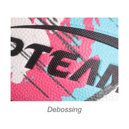 A close-up of a vibrant basketball featuring pink, blue, and black patterns with textured debossing.