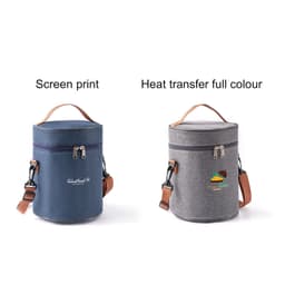 Two cylindrical lunch bags in navy blue and grey, each with a shoulder strap and a logo.