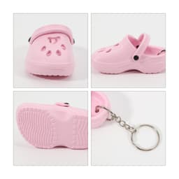 A pink paw shape clog shoe keyring featuring ventilation holes and a silver keyring attachment.