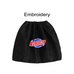 A black boot cover with a round logo featuring red and blue elements, and an embroidered text design.