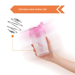 A drink bottle with a pink lid and a clear body, featuring a stainless steel shaker ball inside and a loop.