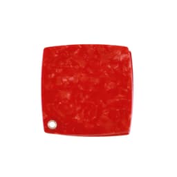 A red acetate vanity mirror with a textured surface and a small hole in the corner.