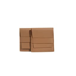 A set of tan PU leather flip jewelry pouches with pockets, featuring a sleek design and a logo.