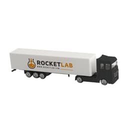 A truck toy model in black and white, featuring a logo on the trailer.