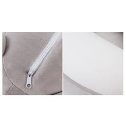A cat-shaped travel pillow in grey and white featuring a zip closure. The product has a plush texture.