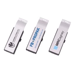 A drink bottle opener that doubles as a silver flash drive. It features an engraved logo on its surface.