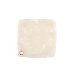 An acetate vanity mirror with a square shape in a pearlescent white finish, featuring a small circular hole and branding.