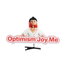 A custom felt hair clip featuring a character with red hair and the phrase "Optimism Joy Me" in bold text.