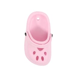 A pink paw-shaped clog shoe fridge magnet featuring ventilated holes and a black button detail.