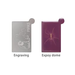 A stainless steel portable mirror featuring a silver engraved surface and a purple epoxy dome. It has a branding logo.
