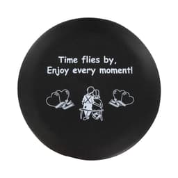 A round black stress reliever featuring a design of two seated figures and an inspirational message in white text.
