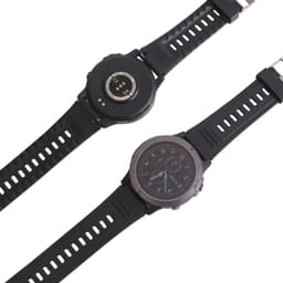 A black round smart watch with a prominent face and adjustable strap, featuring a logo on the back.