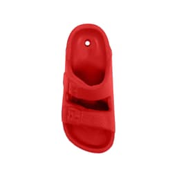 A red fridge magnet shaped like a slide sandal, featuring two straps and a textured surface.